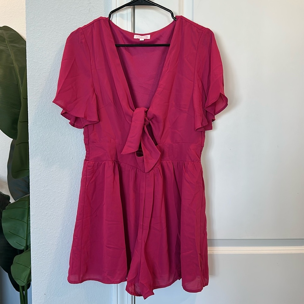NWOT Pink Lily Romper. Size Large. Pink. Front tie. Never worn, smoke free home